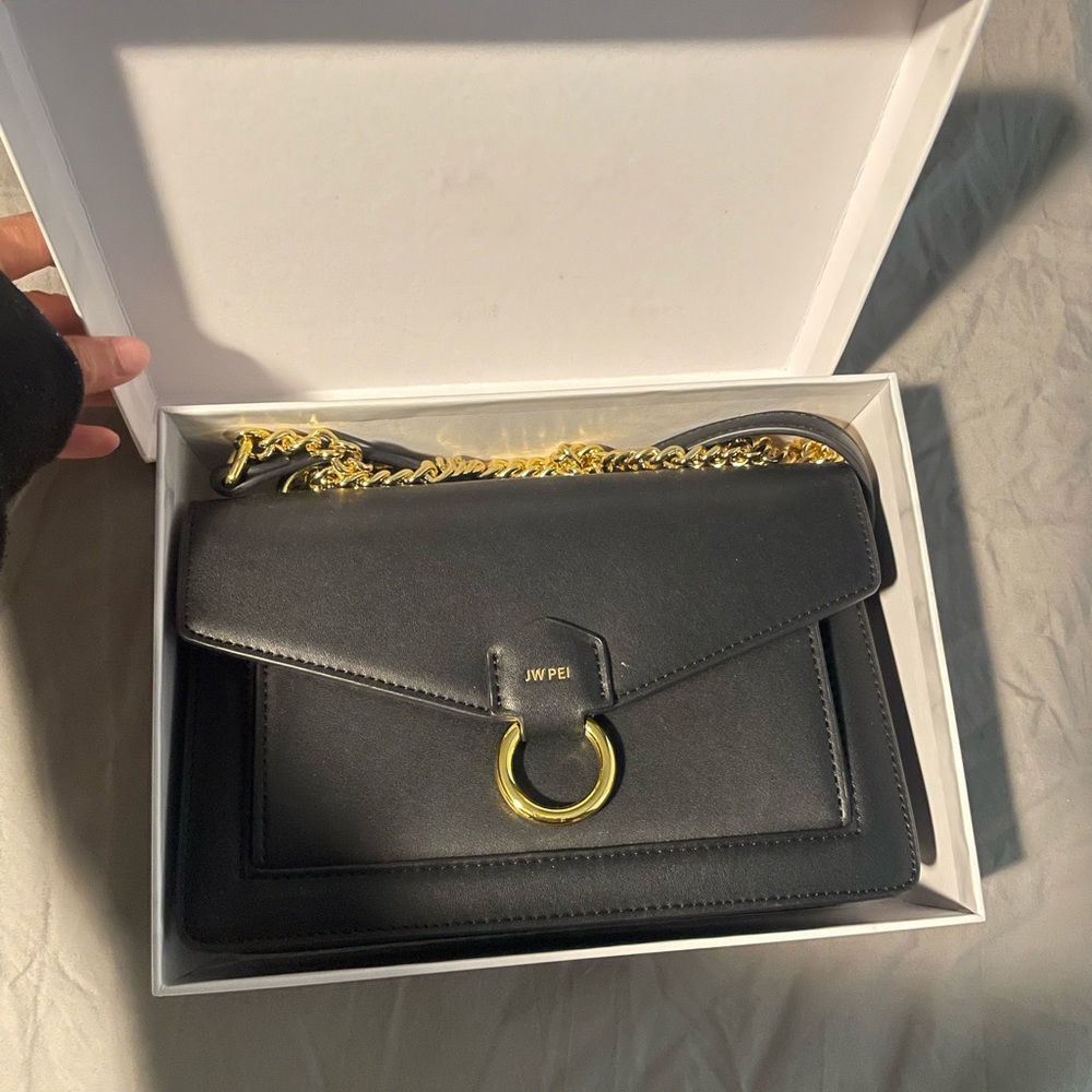 JW PEI Black purse with gold accents and chain